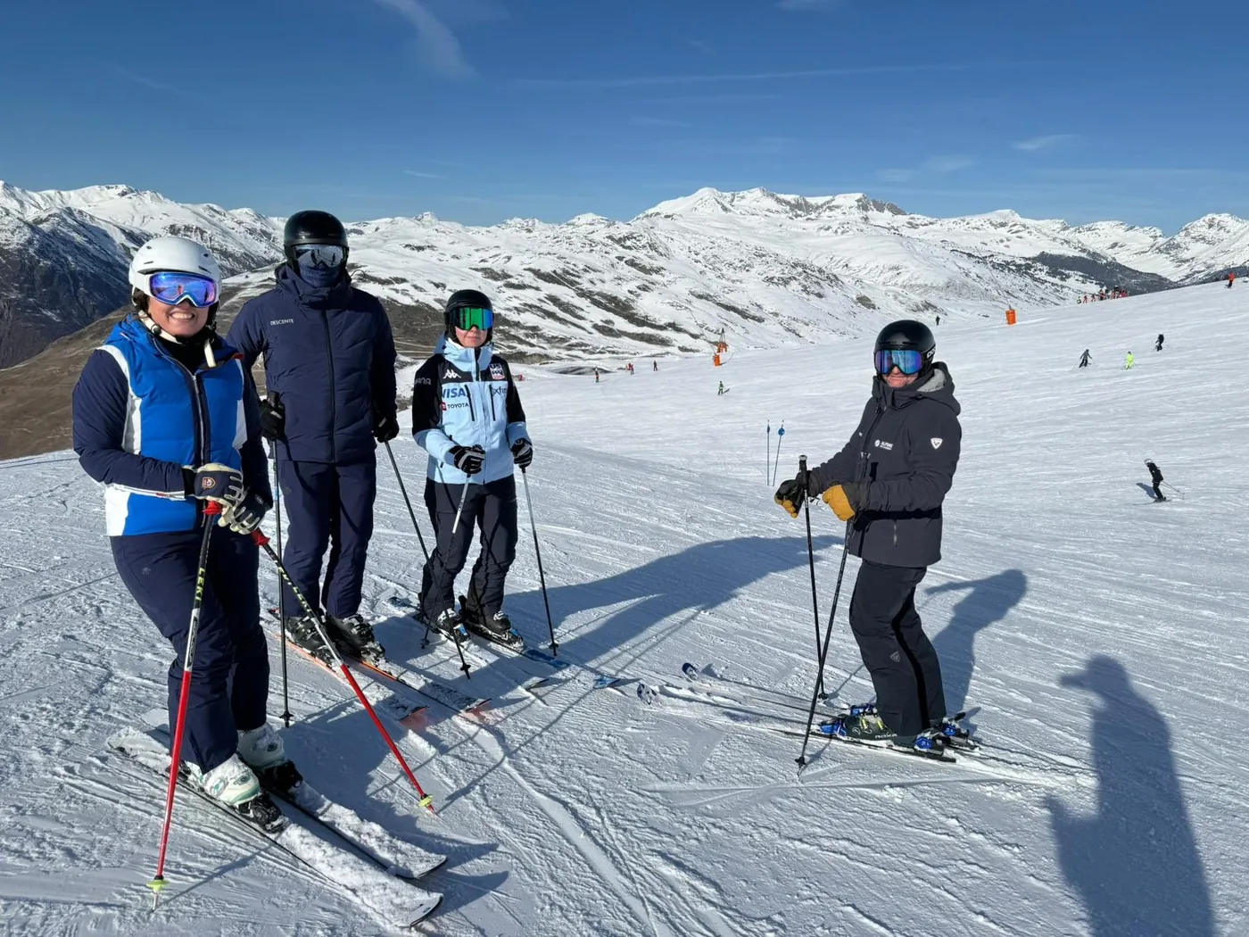 family skiing alongside an Alpine Ski Academy instructor in Baqueira Beret